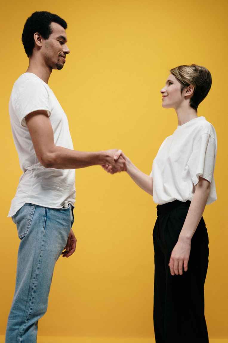 man and woman doing handshake
